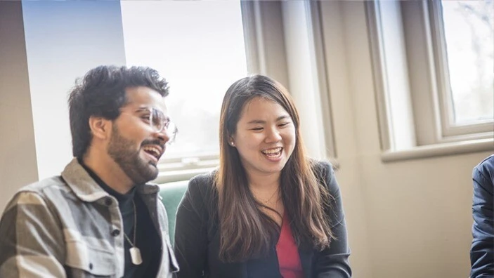 MFin students chatting in the Cafe.