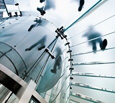 View looking up at a glass staircase.