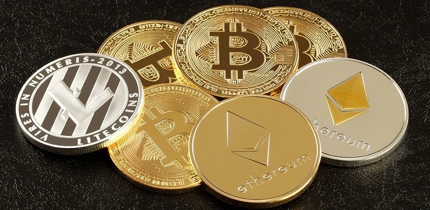 Close up of three main cryptocurrencies: Bitcoin, Ethereum and Litecoin.