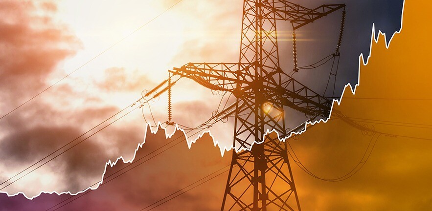 Transmission tower and raising sparkline chart representing electricity prices rise during global energy crisis.