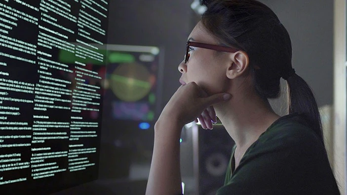 Woman looking at a computer screen.