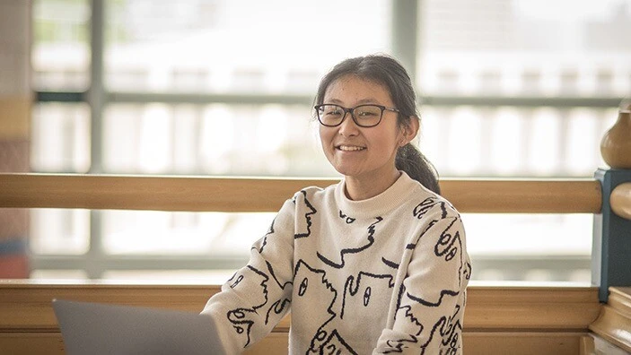 Cambridge student at Cambridge Judge Business School, smiling.