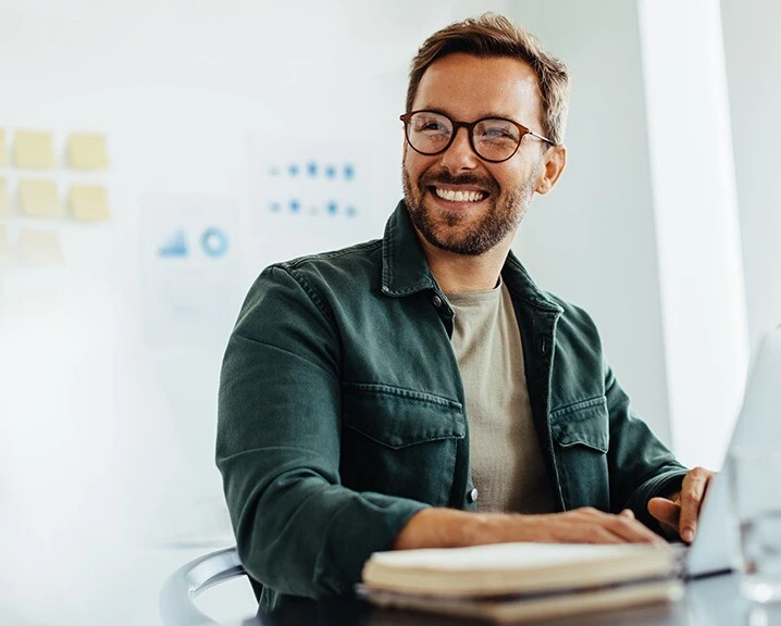 laughing person with glasses.