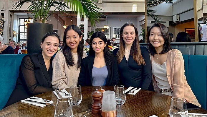 Group of MFin women having dinner.