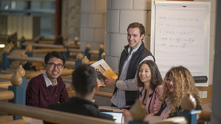 MFin students working on a group project.