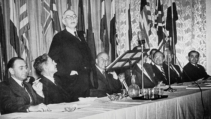 Lord Keynes addresses conference meeting.