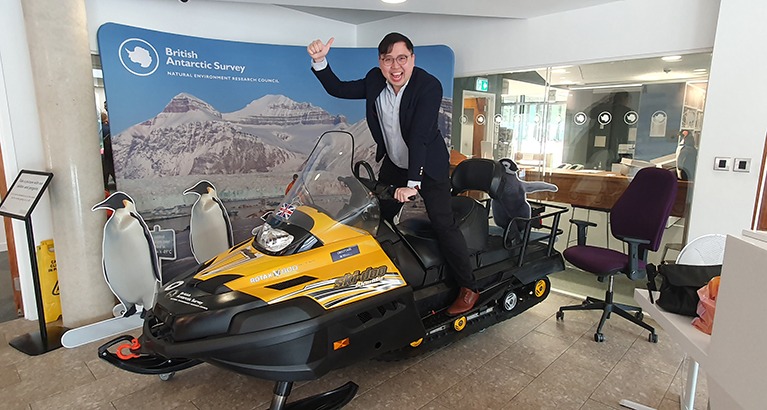 Vincent Leung (EMBA candidate 2023) test drives a snowmobile at the British Antarctic Survey.