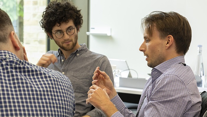 Two men deep in discussion.